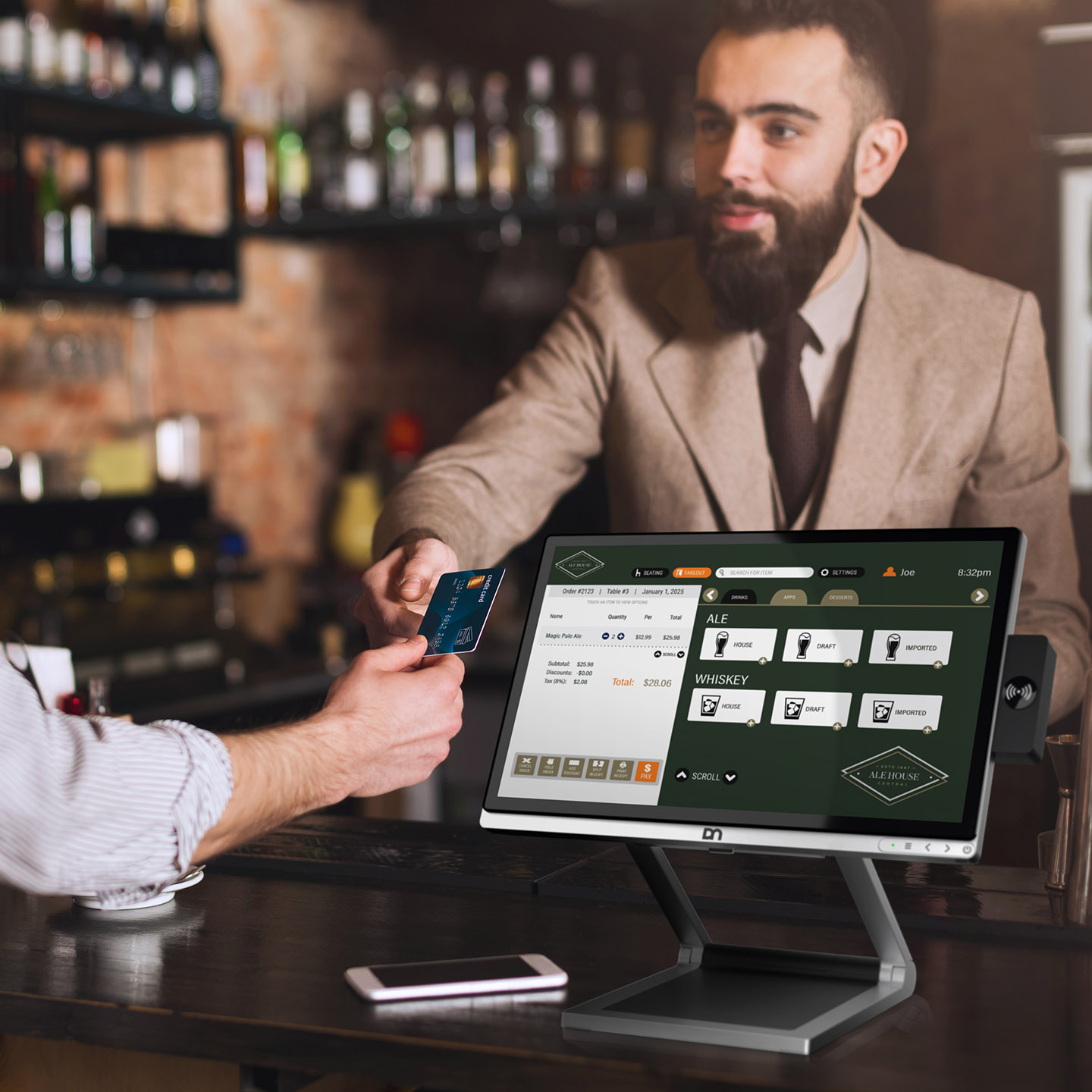 Over the shoulder view of POS dashboard on a store's computer monitor as a man makes a credit card payment